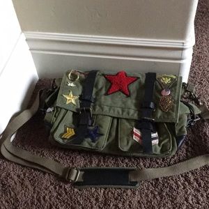Satchel with patches and pins